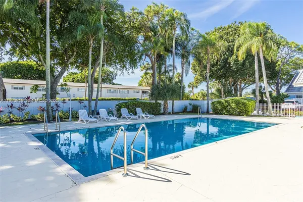 a view of a swimming pool with a patio
