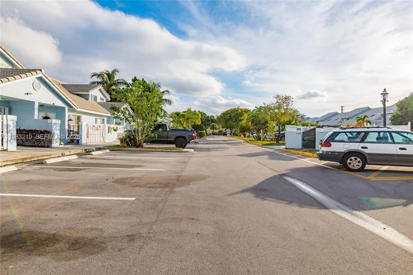 a view of street with parked cars