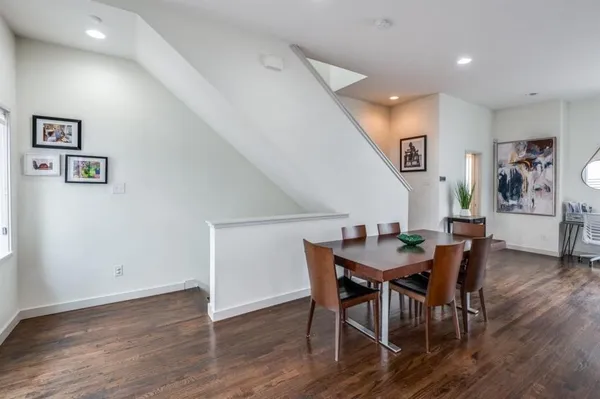 a balcony with a couch and wooden floor