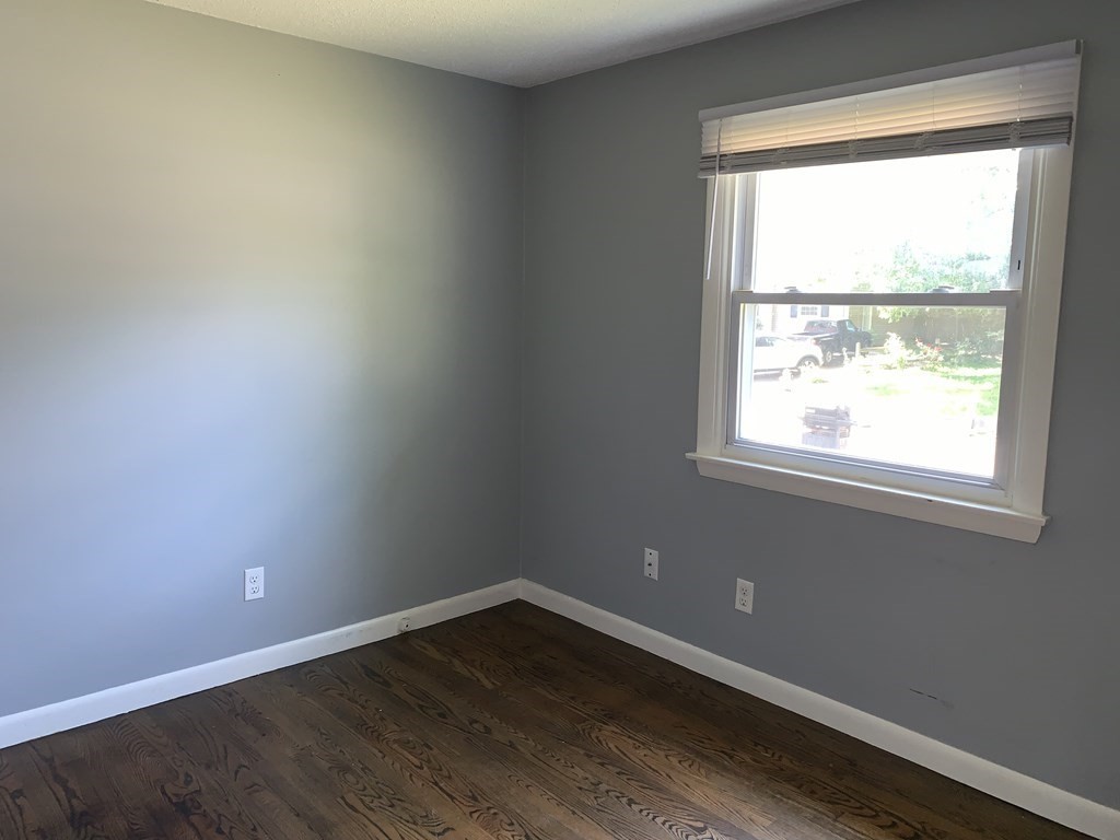 34 Portulaca Drive Springfield, MA 01129 - Photo 13 of 20 an empty room with wooden floor and windows