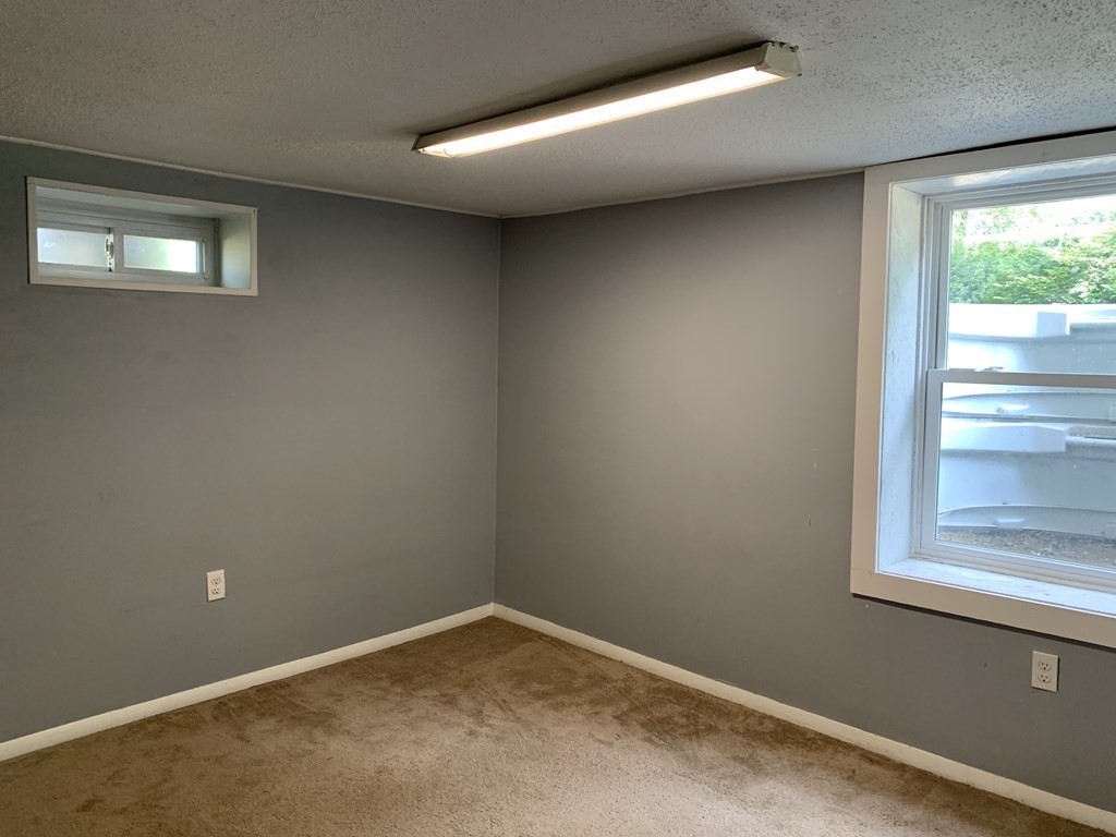 34 Portulaca Drive Springfield, MA 01129 - Photo 17 of 20 an empty room with a window