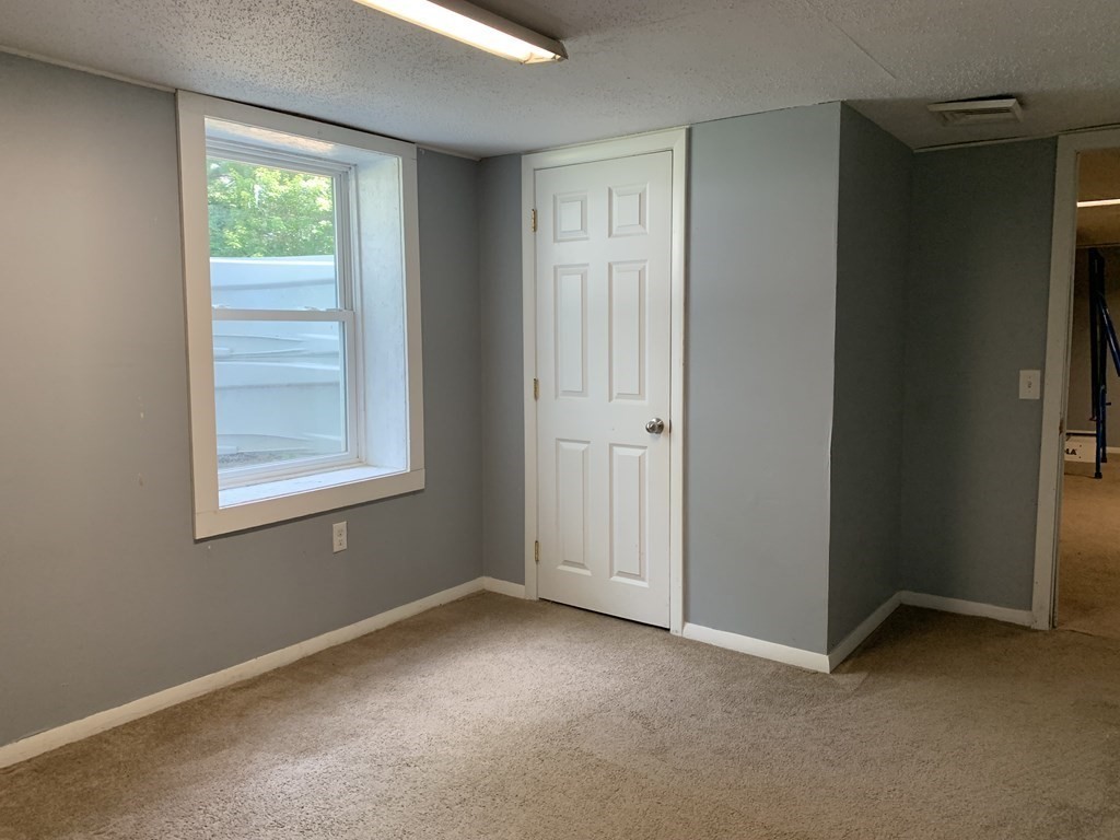 34 Portulaca Drive Springfield, MA 01129 - Photo 18 of 20 a view of an empty room with a window