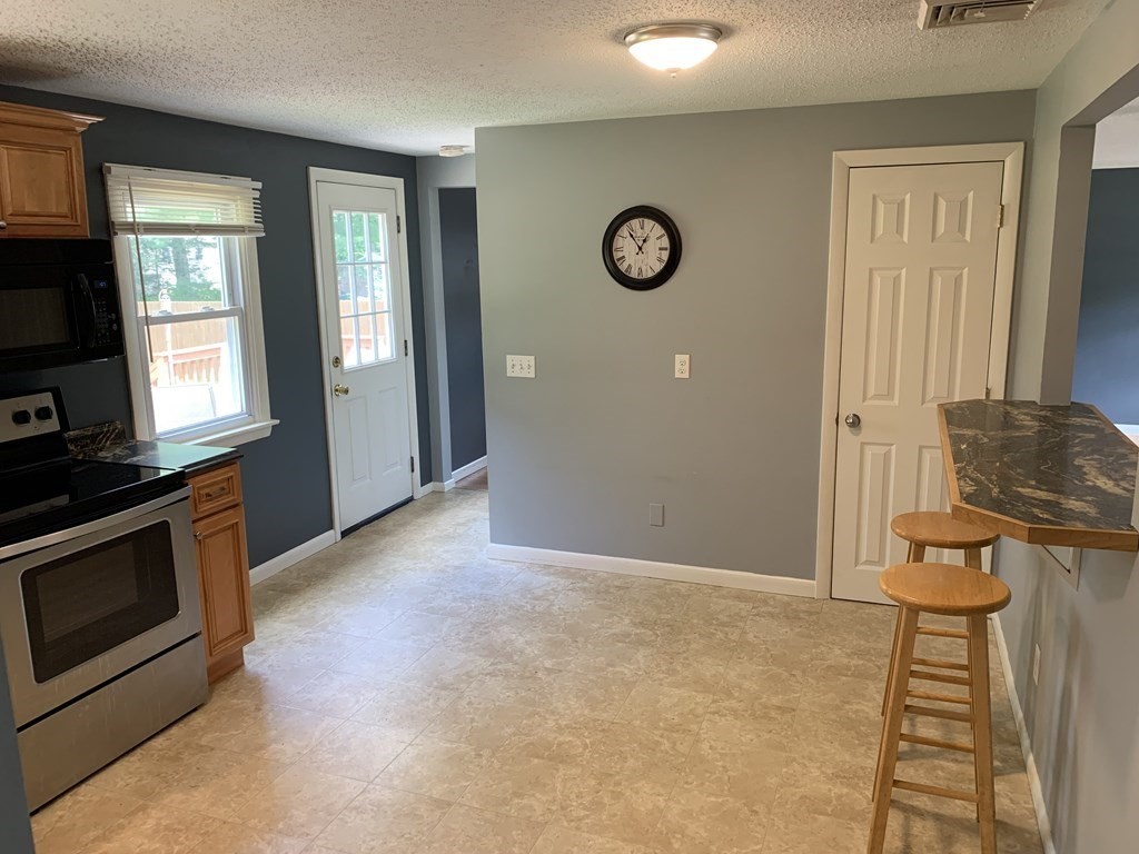 34 Portulaca Drive Springfield, MA 01129 - Photo 7 of 20 an empty room with windows and fireplace