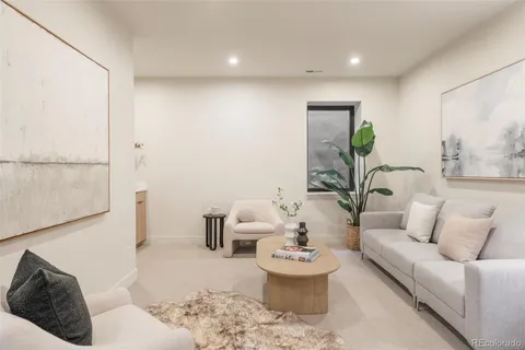a living room with furniture and a rug