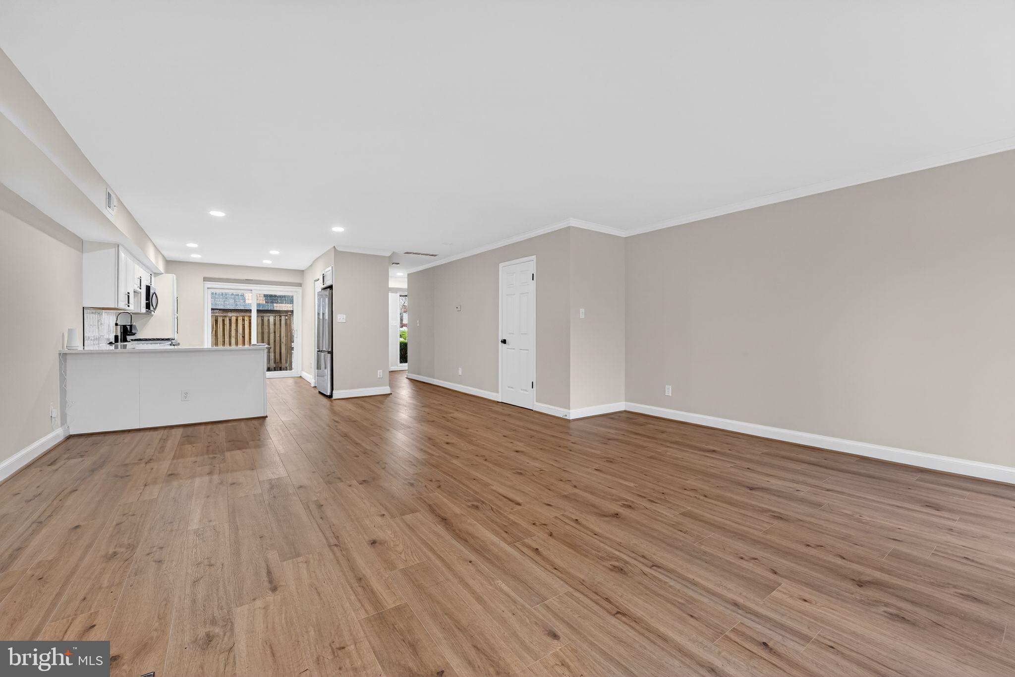 7344 Park Heights Avenue Baltimore, MD 21208 - Photo 12 of 33 a view of a kitchen with wooden floor and a sink