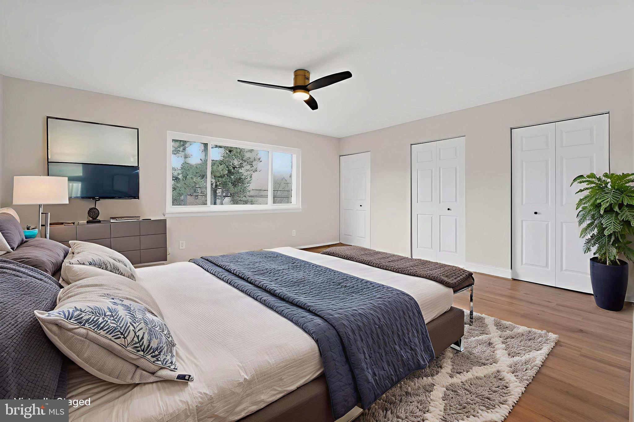 7344 Park Heights Avenue Baltimore, MD 21208 - Photo 19 of 33 a bedroom with a large bed and a couch