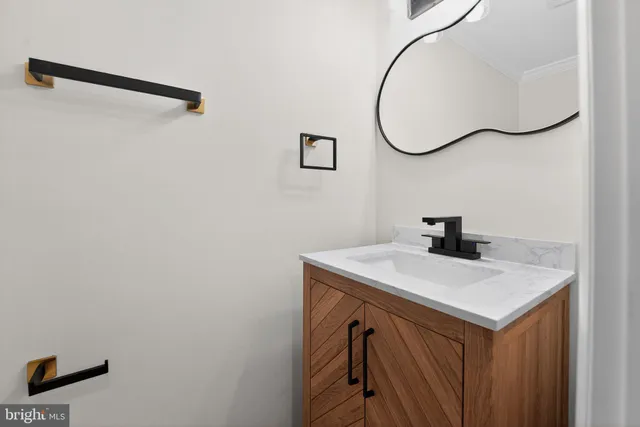 a bathroom with a sink and mirror