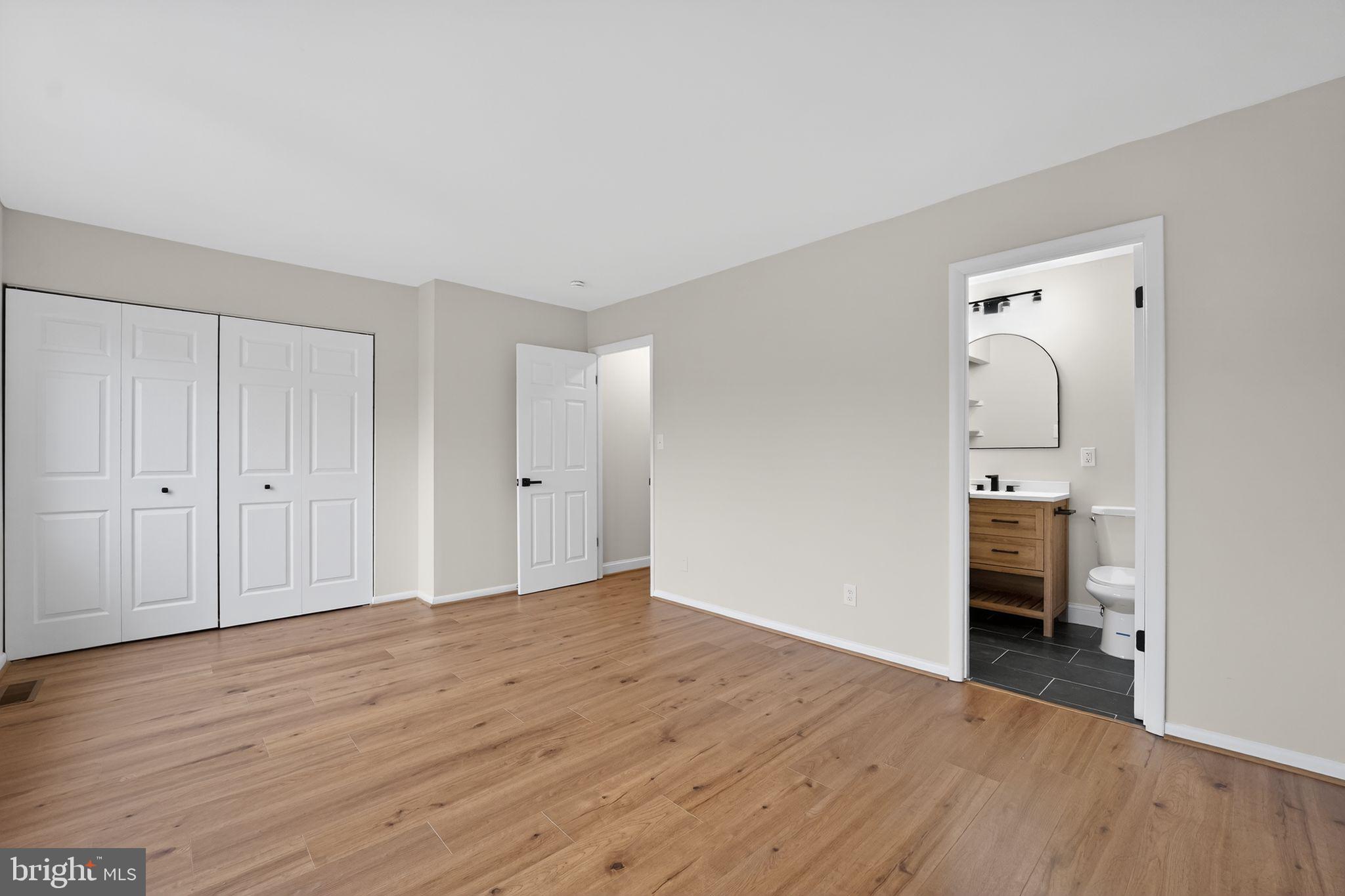 7344 Park Heights Avenue Baltimore, MD 21208 - Photo 23 of 33 a view of empty room with wooden floor