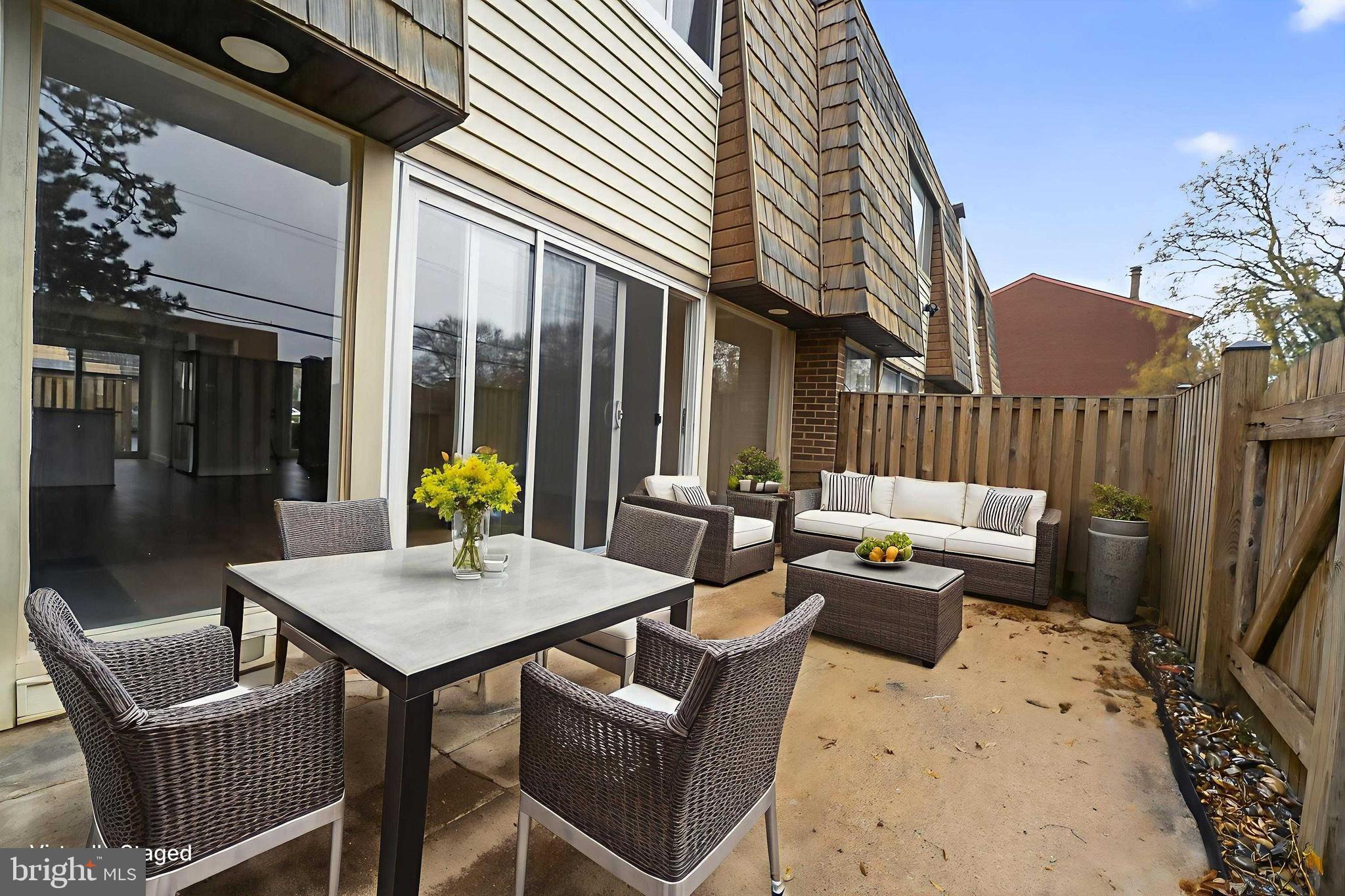 7344 Park Heights Avenue Baltimore, MD 21208 - Photo 25 of 33 a view of a patio with a dining table and chairs