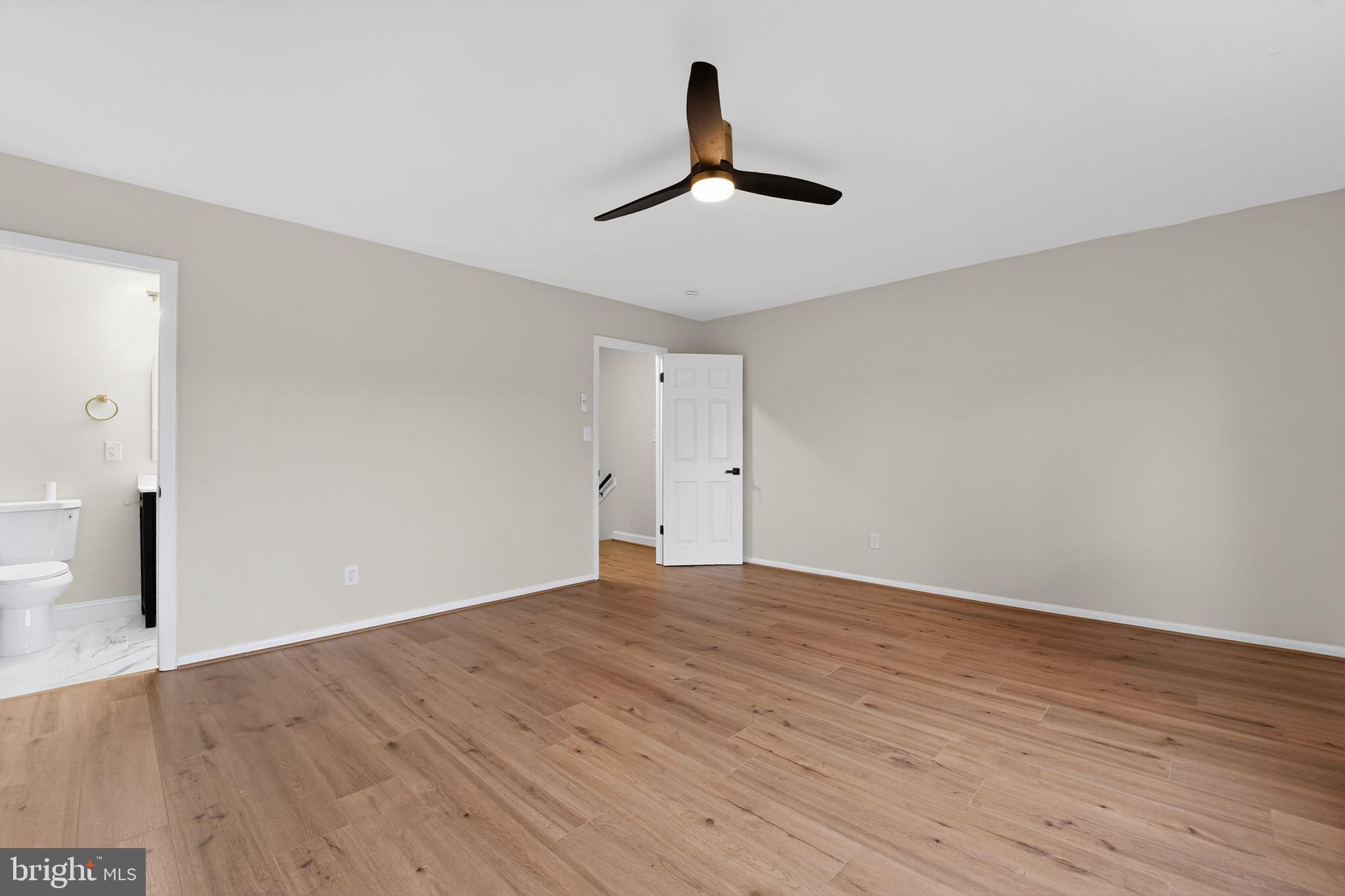 7344 Park Heights Avenue Baltimore, MD 21208 - Photo 27 of 33 a view of an empty room with wooden floor