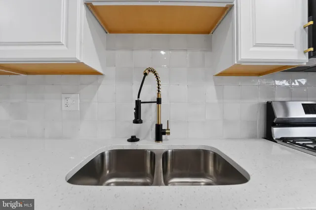a bathroom with a sink and mirror