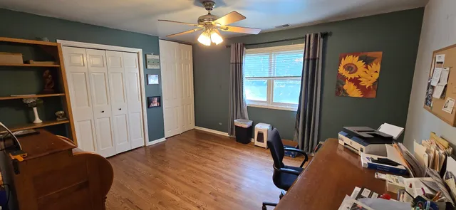 a bedroom with furniture and a window