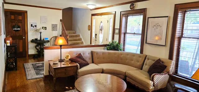 a living room with furniture and a large window