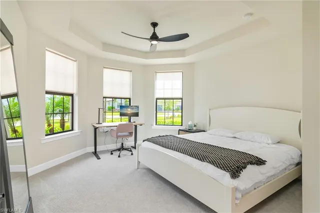 a bed room with a bed and a chair