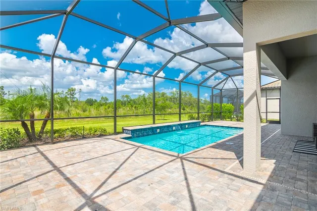 a view of swimming pool with outdoor seating