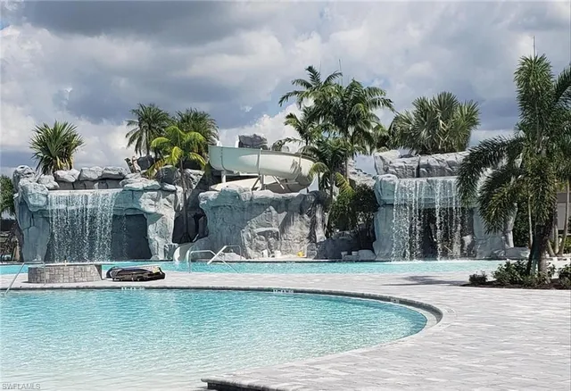 a view of a backyard with a table and chairs