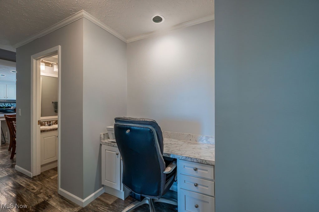 560 Wine Road Elizabeth, WV 26143 - Photo 7 of 50 Office space featuring a textured ceiling, dark wood-style floors, ornamental molding, and built in desk