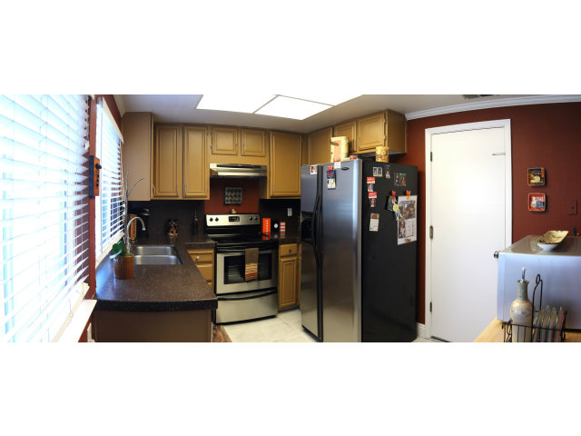 74 Redding Road Campbell, CA 95008 - Photo 6 of 21 a kitchen with stainless steel appliances kitchen island granite countertop a refrigerator and a sink
