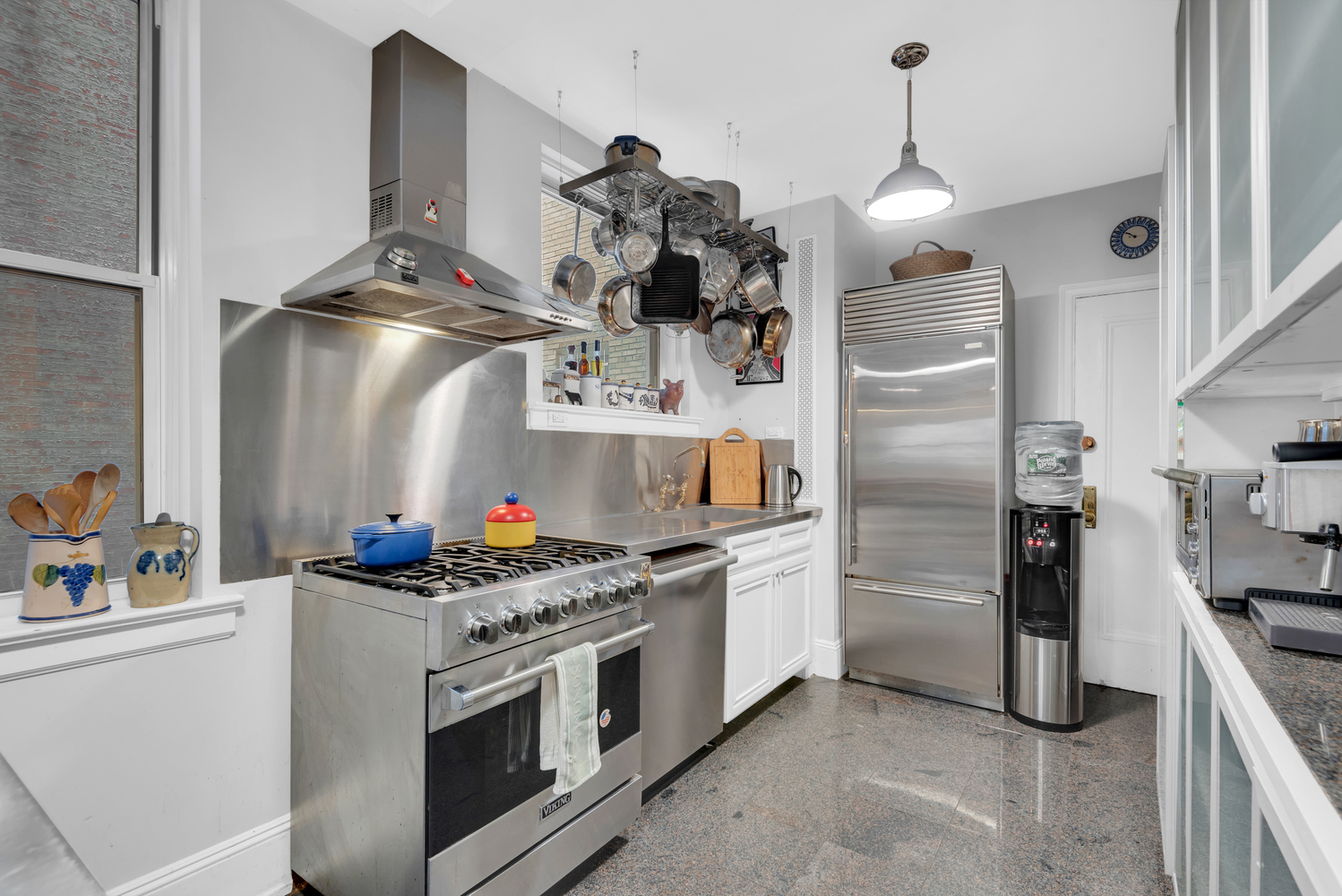 Undisclosed Address Manhattan, NY 10128 - Photo 4 of 9 a kitchen with stainless steel appliances granite countertop a sink and a refrigerator