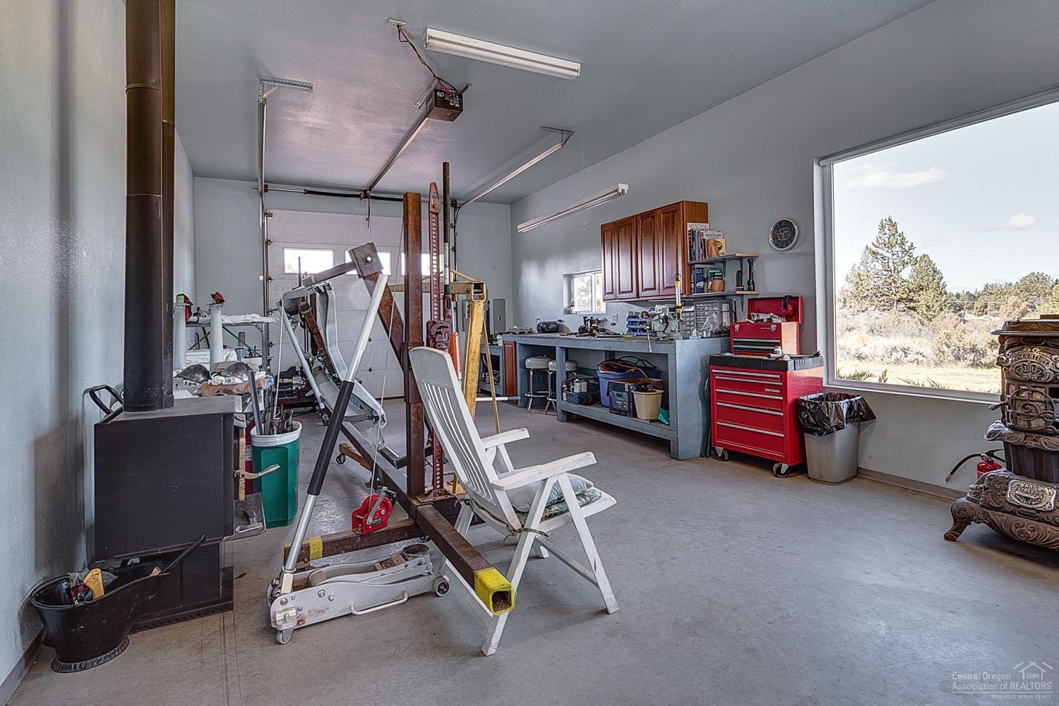 61116 Billadeau Road Bend, OR 97702 - Photo 21 of 25 Large windows in the shop keeps the work