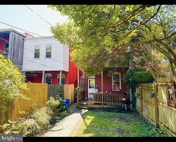 a view of a patio with couches and potted plants