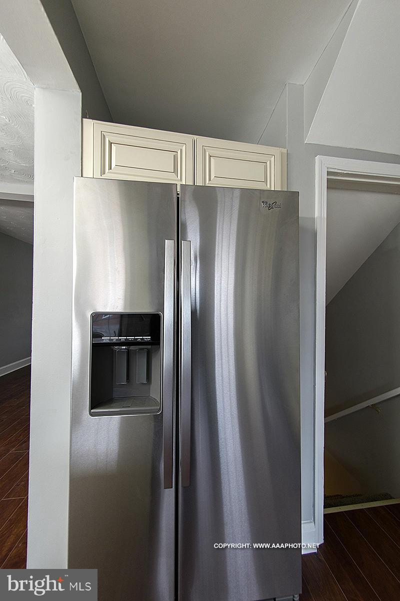 417 Grovethorn Road Middle River, MD 21220 - Photo 5 of 12 a metallic refrigerator freezer sitting in a kitchen