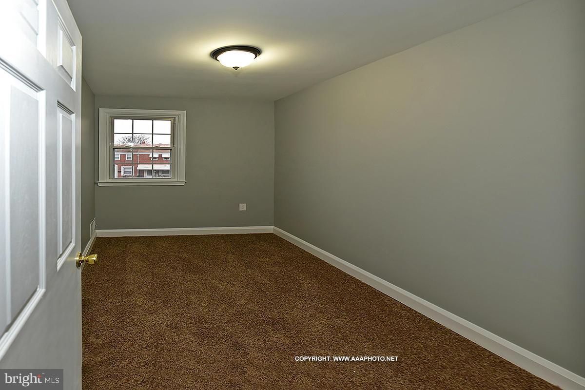 417 Grovethorn Road Middle River, MD 21220 - Photo 7 of 12 an empty room with a window