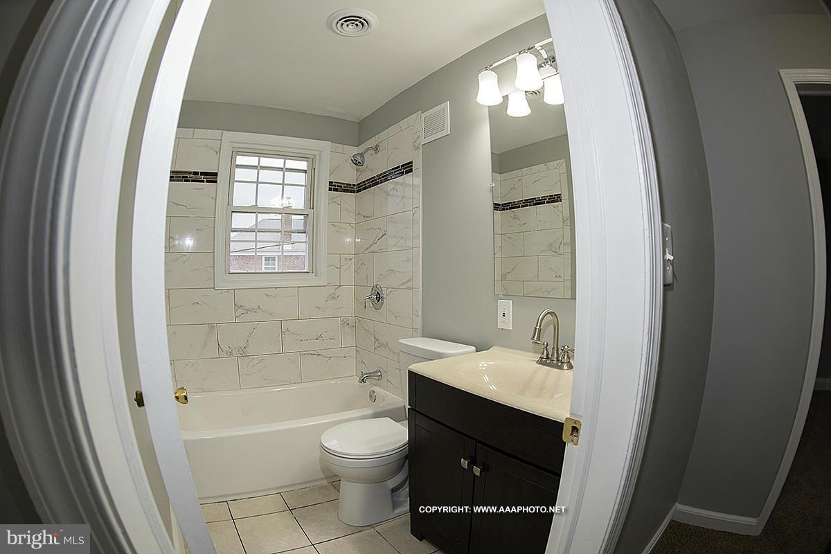 417 Grovethorn Road Middle River, MD 21220 - Photo 10 of 12 a bathroom with a sink a toilet and shower