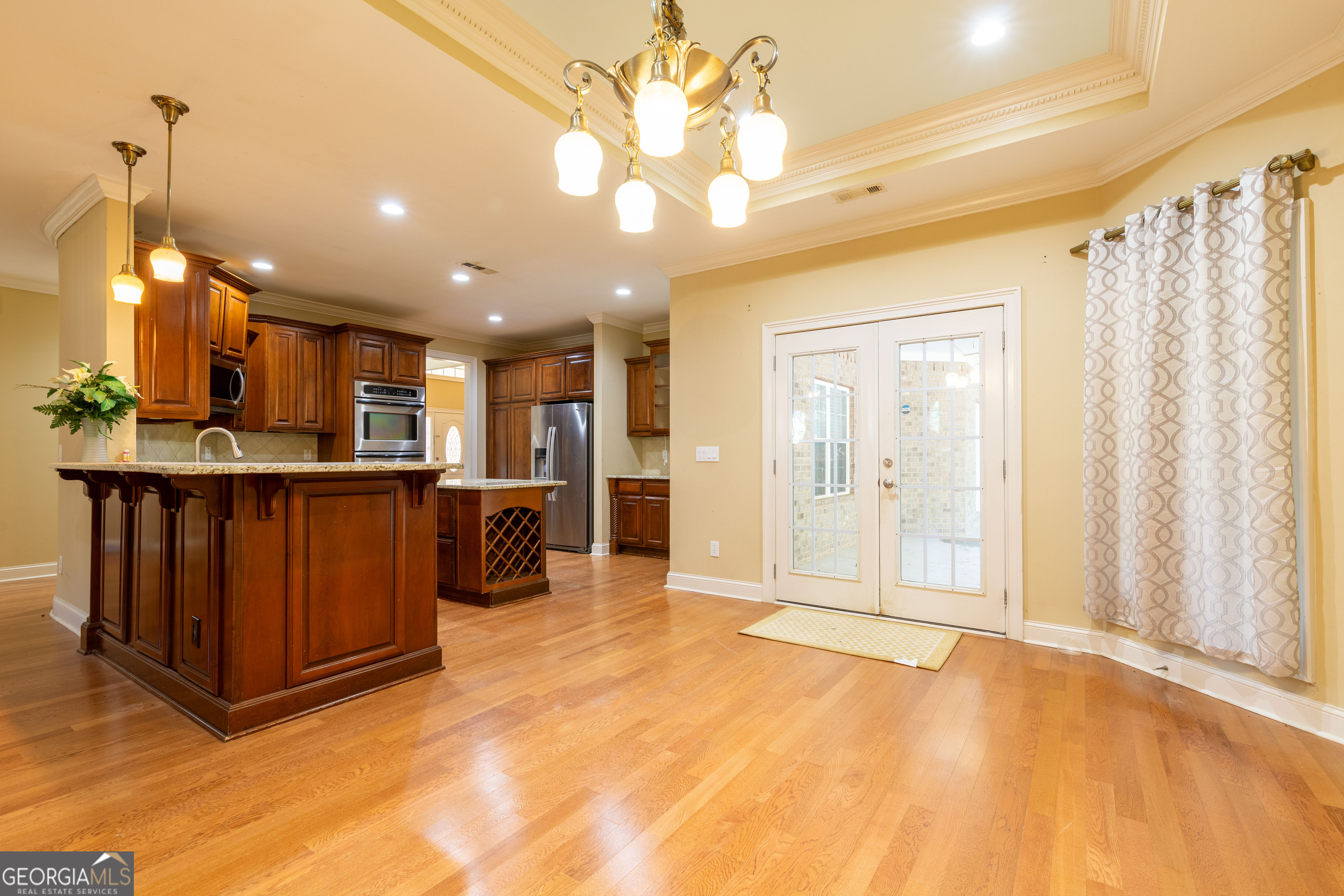 3194 Liverpool Street Jonesboro, GA 30236 - Photo 14 of 44 a view of a kitchen with furniture and a chandelier