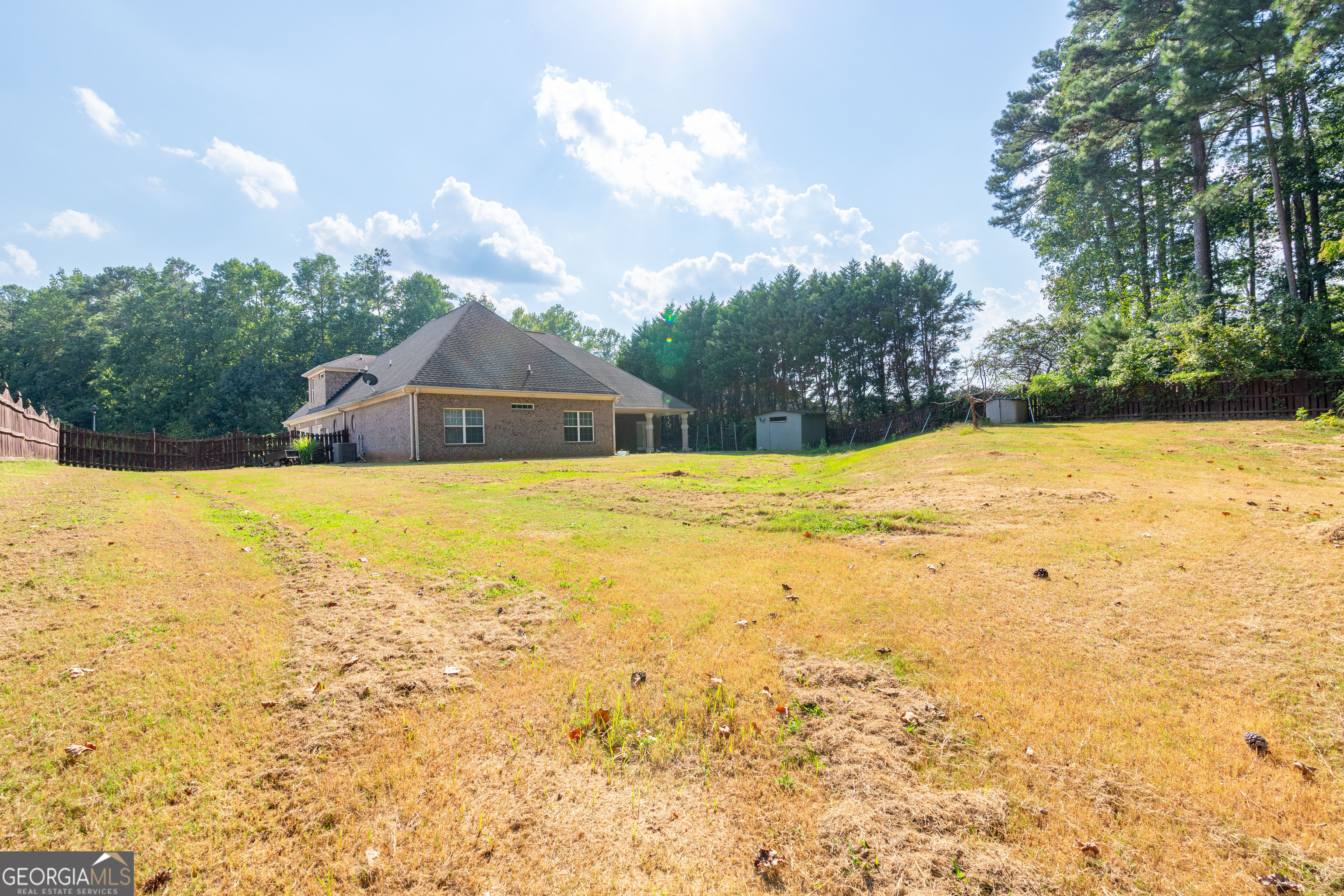 3194 Liverpool Street Jonesboro, GA 30236 - Photo 41 of 44 a swimming pool with an outdoor space and seating area