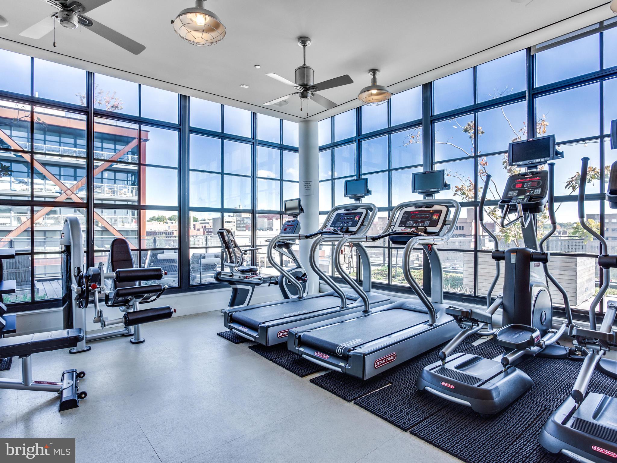 2030 8th Street Northwest, Unit 503 Washington, DC 20001 - Photo 23 of 31 a living room with furniture gym equipment and a view of living room