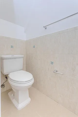 a bathroom with a toilet and a sink