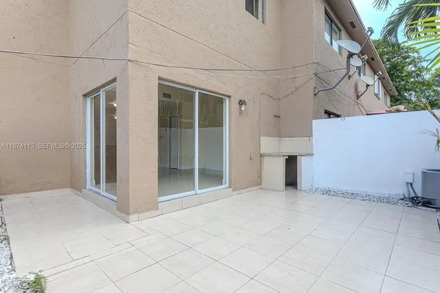 an empty room with entrance and door