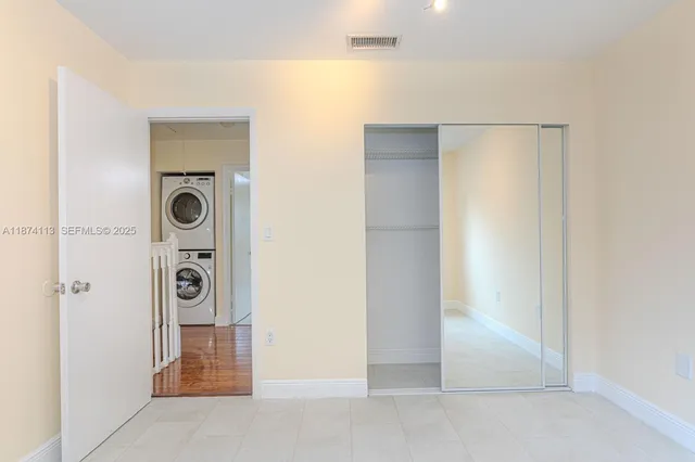 a view of a livingroom with a door and a hallway