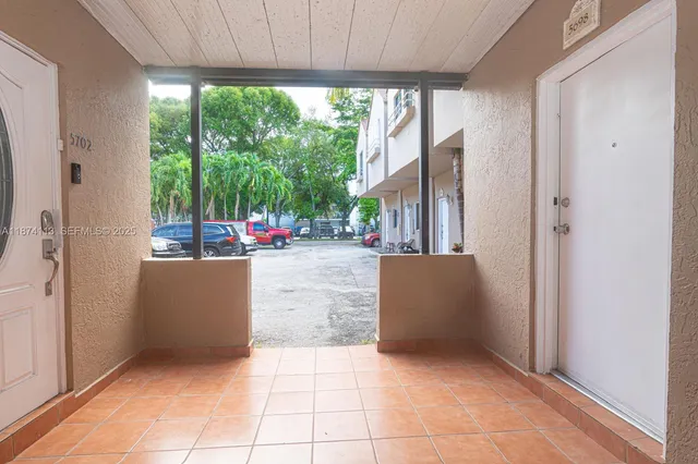 a view of a car in front of a house