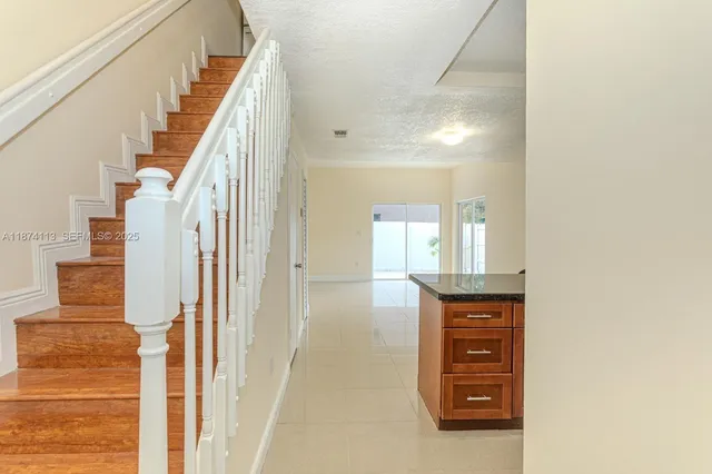 a view of a hallway with front door