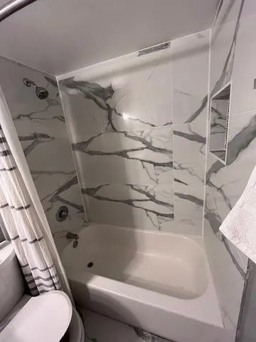 a bathroom with a toilet and a sink