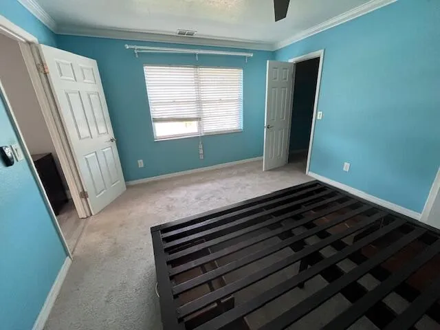 a view of an empty room and wooden floor