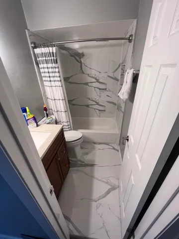 a bathroom with a sink and toilet