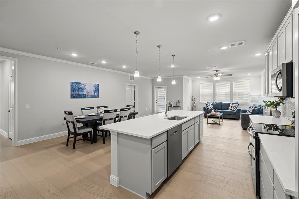 a large kitchen with a table and chairs