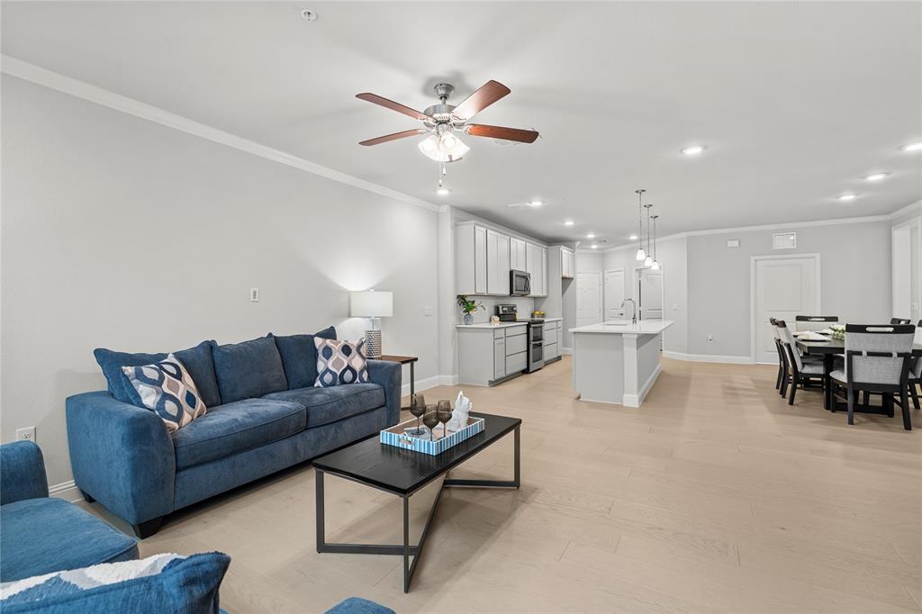 651 Watters Road, Unit 2307 Allen, TX 75013 - Photo 5 of 40 a living room with furniture and kitchen view