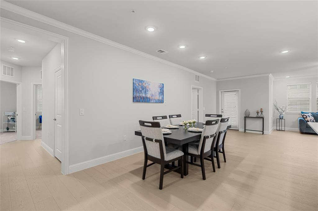651 Watters Road, Unit 2307 Allen, TX 75013 - Photo 8 of 40 a view of a dining room with furniture