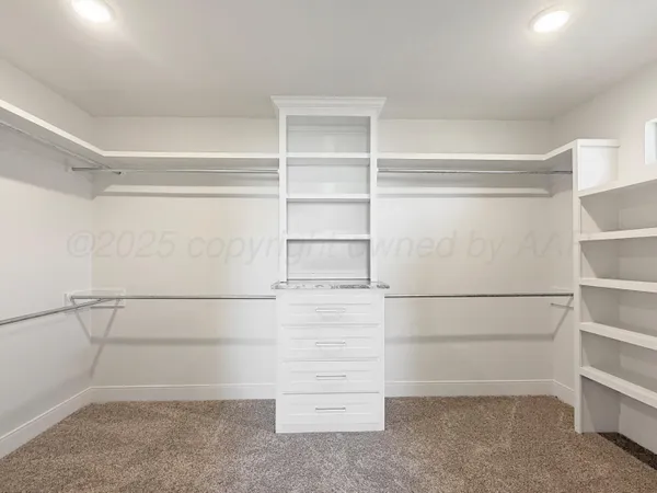 a view of an empty walk in closet