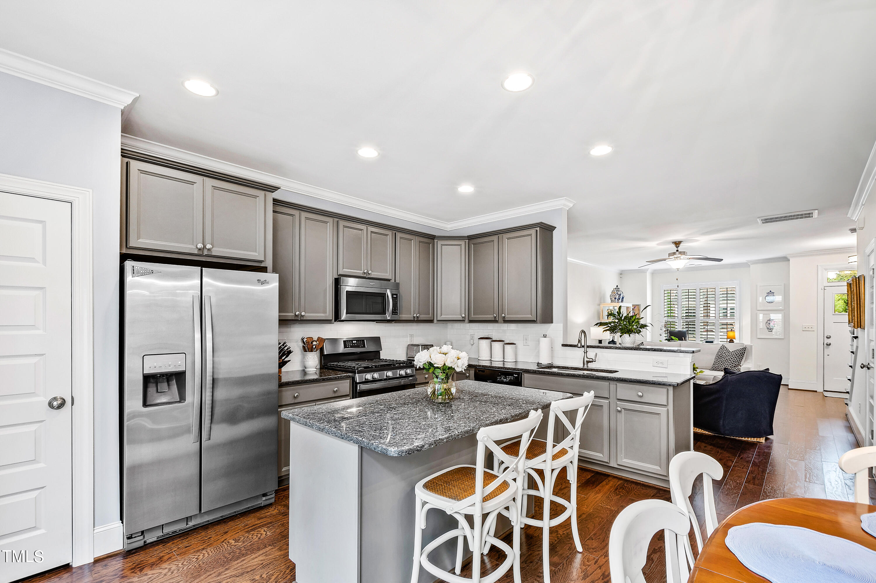 525 Ledbetter Court Raleigh, NC 27608 - Photo 14 of 45 a kitchen with stainless steel appliances granite countertop a refrigerator sink and stove