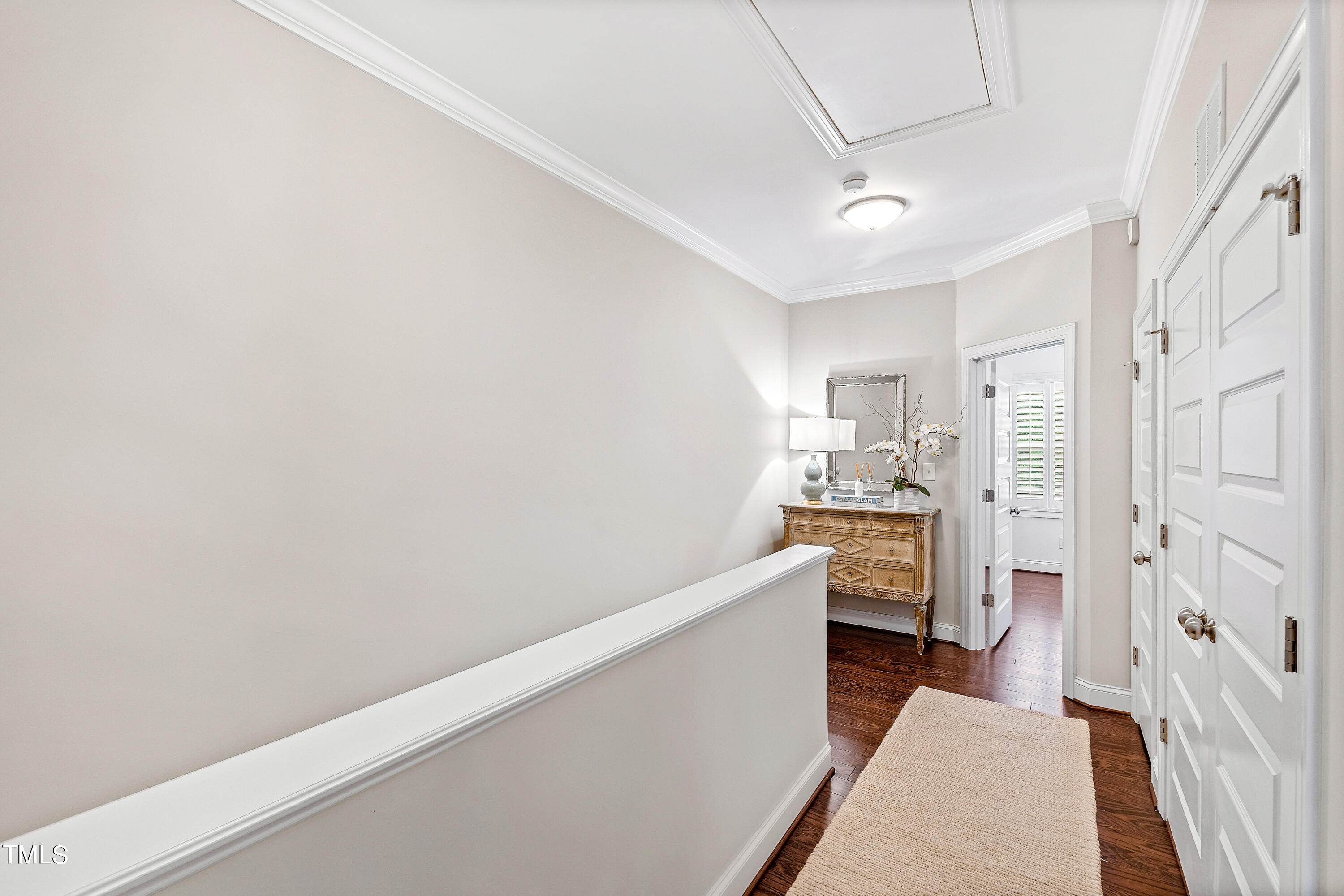 525 Ledbetter Court Raleigh, NC 27608 - Photo 22 of 45 a hallway with white cabinets and white appliances