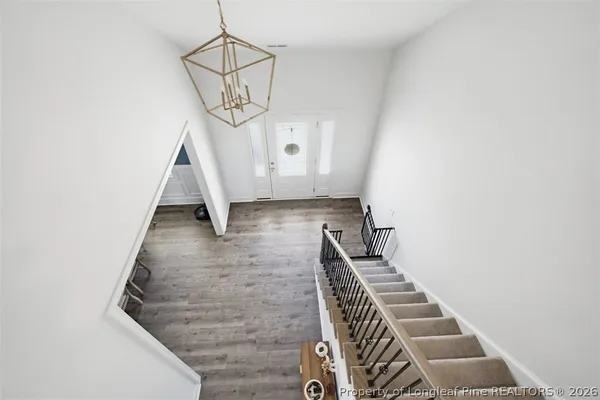 a living room with furniture and a ceiling fan