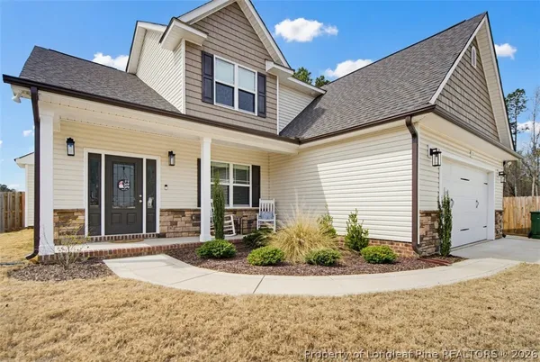 a front view of a house with a yard