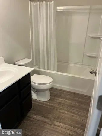 a bathroom with a toilet and a bathtub