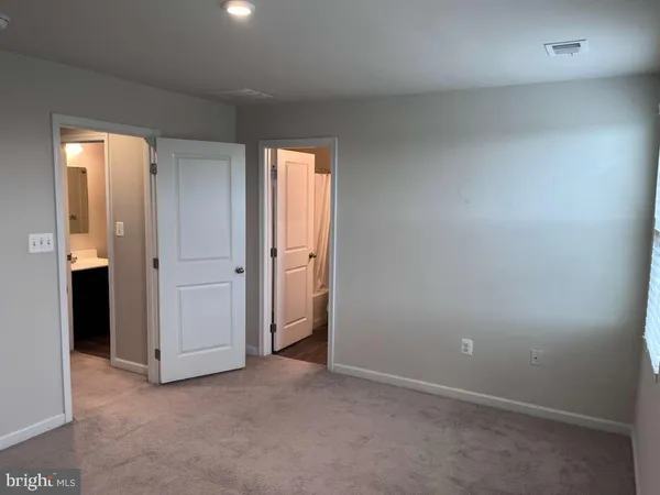 a bathroom with a sink toilet and mirror