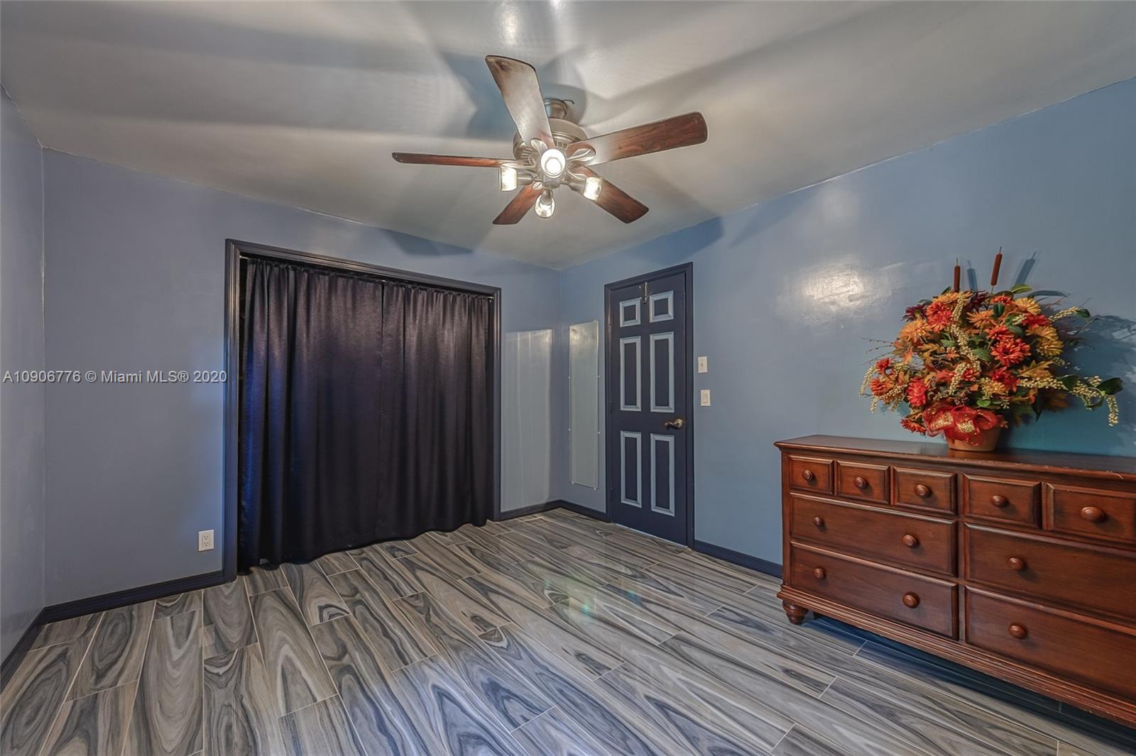 4860 Southwest 193rd Lane Southwest Ranches, FL 33332 - Photo 53 of 80 a bedroom with a bed and a dresser